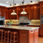 Kitchen featuring warm, elegant cherry cabinets with classic hardware, natural light, and modern design elements.